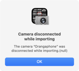 Error dialog from Image Capture, saying "Camera disconnected while importing, The camera 'Orangaphone' was disconnected while importing.(null)".